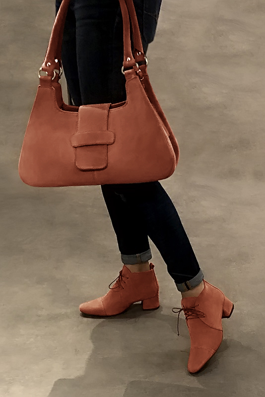 Terracotta orange women's ankle boots with laces at the front. Round toe. Low flare heels. Worn view - Florence KOOIJMAN
